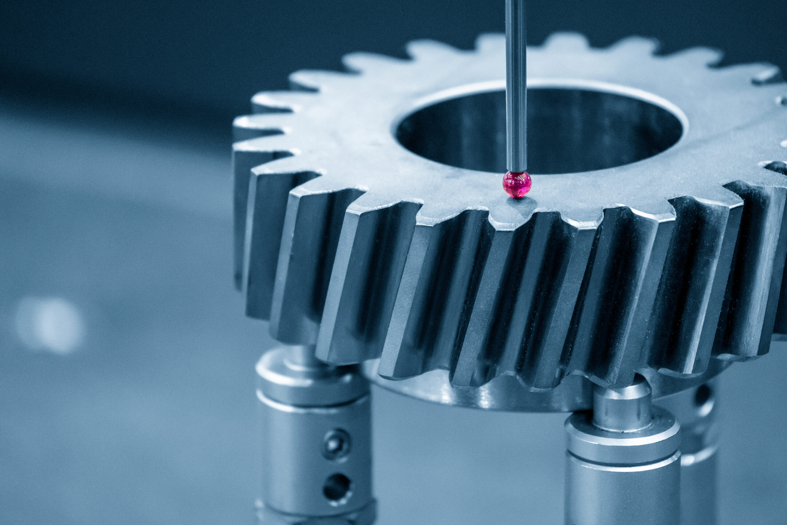 Precision milled gear being inspected